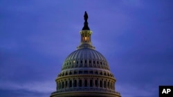 The light in the cupola of the Capitol Dome is illuminated, in Washington, Oct. 6, 2021. 