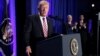 FILE - U.S. President Donald Trump is applauded by Vice President Mike Pence and House Speaker Paul Ryan as he arrives to speak at a congressional Republican retreat in Philadelphia, Jan. 26, 2017.