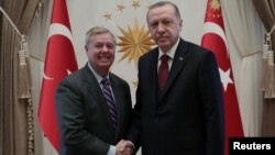 Turkish President Tayyip Erdogan meets with U.S. Senator Lindsey Graham at the Presidential Palace in Ankara, Turkey, Jan. 18, 2019.