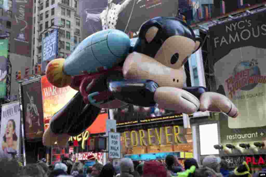 Julius, a jetpack-wearing monkey made by Paul Frank is seen during the Macy's Thanksgiving Day Parade in Times Square in New York on Thursday, Nov. 24, 2011. The parade premiered in 1924, this is its 85th year. (AP Photo/Andrew Burton)