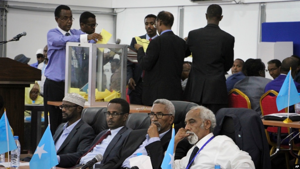 FILE - Votes are counted in the first round of the presidential election in Mogadishu, Somalia, Feb. 8, 2017. 