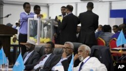 FILE - Votes are counted in the first round of the presidential election in Mogadishu, Somalia, Feb. 8, 2017. 