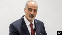 Head of the Syrian government delegation Bashar al-Ja'afari is seen at a meeting during Syrian peace talks at the European headquarters of the United Nations in Geneva, Switzerland, Dec. 14, 2017.