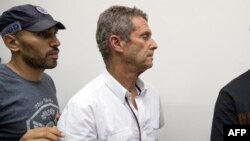 FILE: French-Israeli diamond magnate Beny Steinmetz sits at the Israeli Rishon Lezion Justice court, near Tel Aviv on August 14, 2017 after he was detained as part of an international money laundering investigation, authorities said.