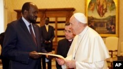 Pope Francis exchanges gifts with South Sudan President Salva Kiir during a private audience at the Vatican, March 16, 2019.