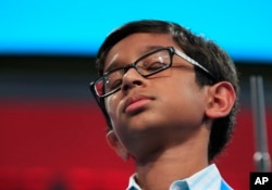 Rohan Rajeev, 14, from Edmond, Okla., reacts after misspelling his word and eventually losing to Ananya Vinay from Fresno, Calif., during the finals of the 90th Scripps National Spelling Bee, in Oxon Hill, Md., June 1, 2017.