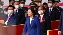 FILE: Taiwan's President Tsai Ing-wen attends national day celebrations in front of the Presidential Palace in Taipei, Oct. 10, 2021. Taiwan's president said Oct. 27, 2021 she has "faith" the United States would defend the island against a Chinese attack.