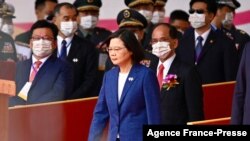 FILE: Taiwan's President Tsai Ing-wen attends national day celebrations in front of the Presidential Palace in Taipei, Oct. 10, 2021. Taiwan's president said Oct. 27, 2021 she has "faith" the United States would defend the island against a Chinese attack.