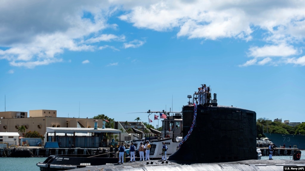 In this photo provided by U.S. Navy, the Virginia-class fast-attack submarine USS Illinois (SSN 786) returns home to Joint Base Pearl Harbor-Hickam from a deployment in the 7th Fleet area of responsibility on Sept. 13, 2021.