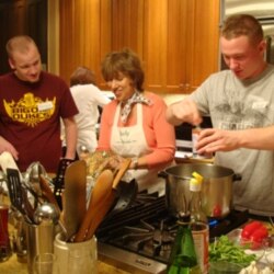 Judy Harris helps Danny Becker, left, and Jeff Van Meter make a Thai shrimp curry