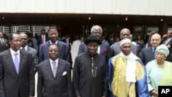 Heads of state and members of the Economic Community Of West African States (ECOWAS) pose for a photograph after attending the 39th ECOWAS Summit in Nigeria's capital Abuja March 23, 2011