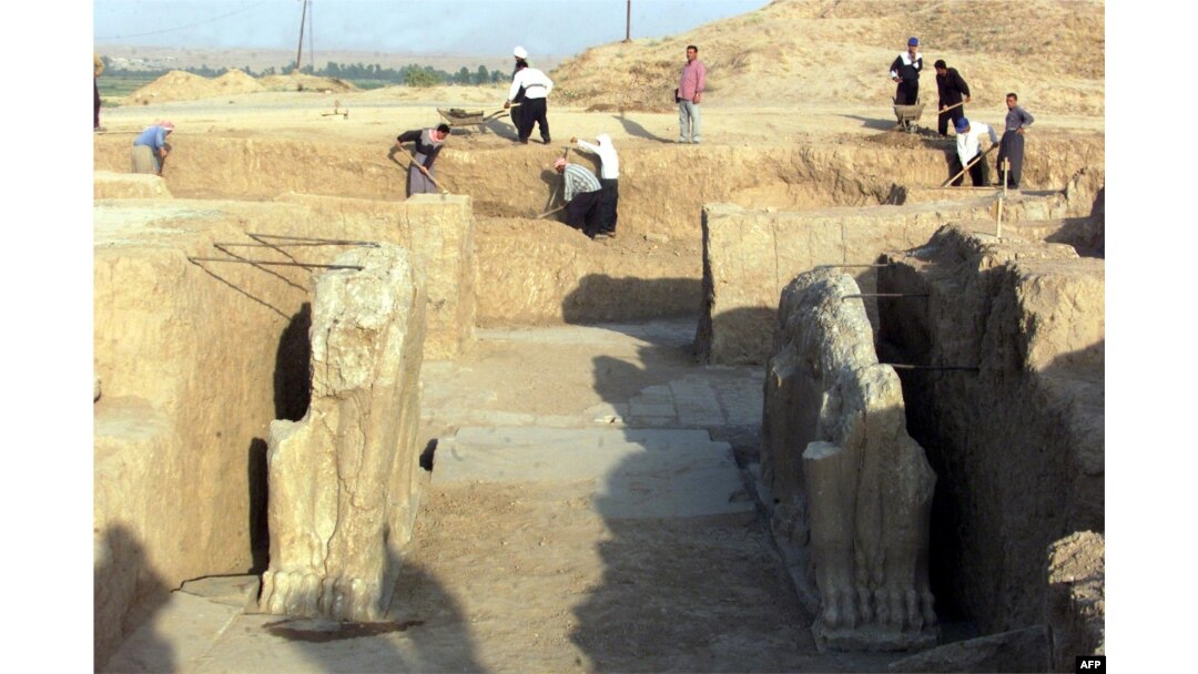 FILE - Iraqi workers in 2001 clean an archeological site in Nimrud. The Islamic State group has bulldozed the ancient Assyrian city, Iraq's government says, March 5, 2015.