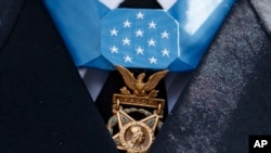 The Medal of Honor hangs around the neck of Medal of Honor recipient Army Staff Sgt. David Bellavia, June 25, 2019.