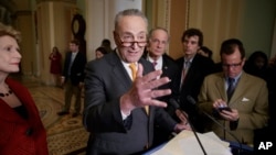 FILE - Senate Minority Leader Charles Schumer of N.Y., speaks with reporters following a closed-door strategy session, March 28, 2017, on Capitol Hill in Washington. 