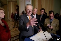 Senate Minority Leader Charles Schumer of N.Y., speaks with reporters following a closed-door strategy session, March 28, 2017, on Capitol Hill in Washington.