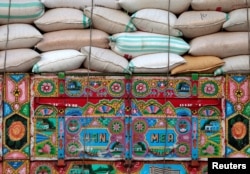 Artwork is seen on a decorated truck carrying sacks of wheat in Charsadda, Pakistan, May 1, 2017.