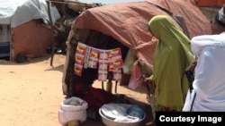 A small, woman-run store at the Hidaya Camp, on the outskirts of Mogadishu, sells detergent, coffee, charcoal and candy. (Photo courtesy of Filsan Darman) 