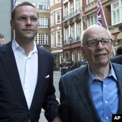 James and Rupert Murdoch (C) and a minder leave the Stafford Hotel in St James's Place, central London July 10, 2011.