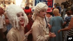 Bigwigs are worn for Bastille Day celebration in New York on July 13, 1997. (AP File photo)