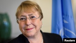 Former Chilean president Michelle Bachelet poses in her office at the Palais Wilson on her first day as new United Nations (UN) High Commissioner for Human Rights in Geneva, Switzerland, Sept. 3, 2018. 