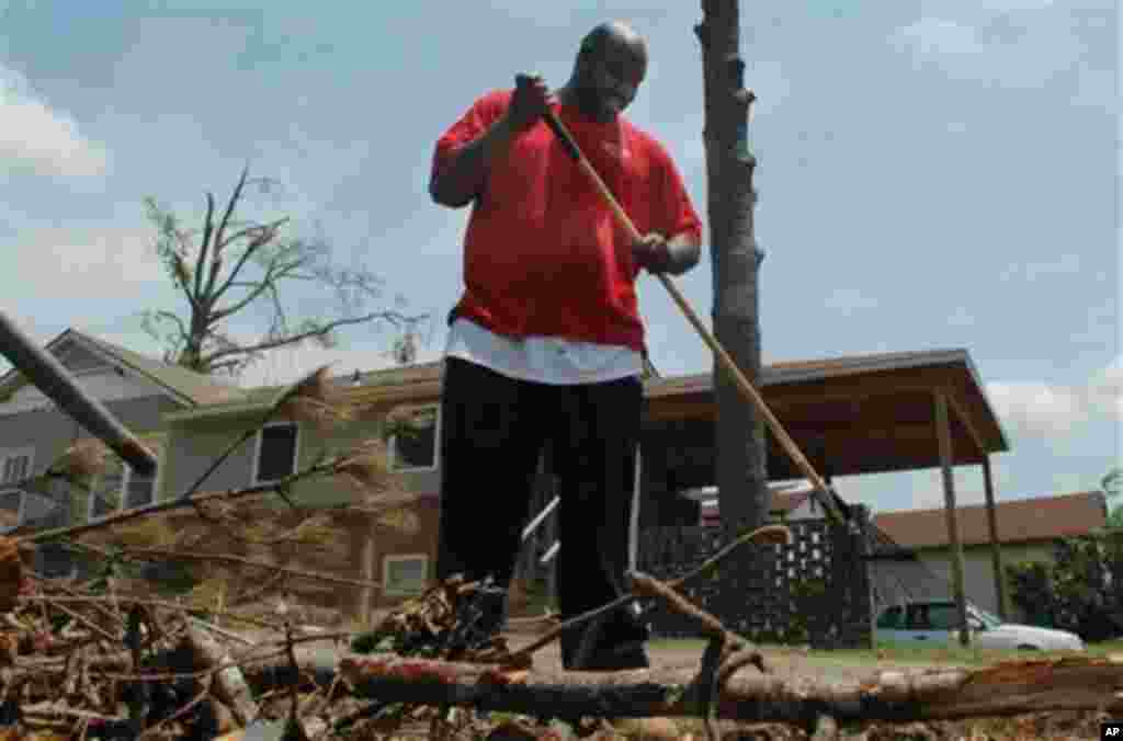 Sherman James cleans up from the tornadoes that devastated Alabama last month at his home in Tuscaloosa, Ala., on Monday, May 23, 2011. James said he is praying for midwesterners in places like Joplin, Mo., following a round of killer twisters there. (AP 