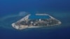 FILE - An aerial view shows Southwest Cay, also known as Pugad Island, controlled by Vietnam and part of the Spratly Islands in the disputed South China Sea, April 21, 2017.
