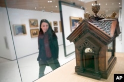 This Wednesday, Jan. 9, 2019, photo shows a British Edwardian-style Dog House for a Chihuahua on display at the American Kennel Club Museum of the Dog in New York. The museum opens Feb. 8. (AP Photo/Mary Altaffer)