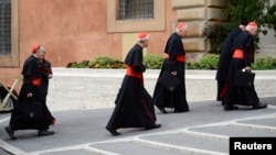U.S. Cardinals (L-R) Daniel Di Nardo, Donald Wuerl, William Levada, and Francis George arrive for a meeting in the Synod Hall at the Vatican, Mar. 8, 2013.