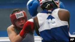 FILE - Reigning champion Patricia Manuel, of Commerce, Calif., competes in a 132-pound division at the 2010 USA boxing national championships, July 15, 2010, in Colorado Springs, Colo. Saturday night, Manuel, a transgender male, won his first professional bout.