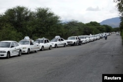 Motorists line up outside a gas station of the Venezuelan state-owned oil company PDVSA in San Antonio, Venezuela, Sept. 4, 2018.