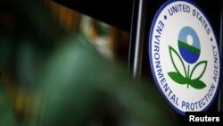 FILE - The U.S. Environmental Protection Agency (EPA) sign is seen on the podium at EPA headquarters in Washington, July 11, 2018. 