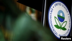 FILE - The U.S. Environmental Protection Agency logo is seen on a podium at EPA headquarters in Washington, July 11, 2018.