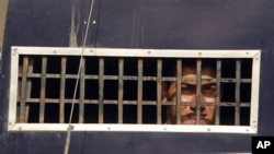 One of the convicted American Muslims looking out from a prison van in Sargodha, Pakistan (file photo)