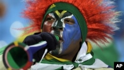 A South African soccer fan blows a vuvuzela in Pretoria during World Cup play, June 16, 2010