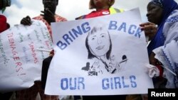 People take part in a protest demanding the release of abducted secondary school girls from the remote village of Chibok, in Lagos, May 5, 2014.