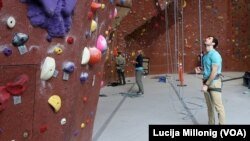 Brigham Young University international student Faris Naffa prepares to climb the wall at a local rock climbing gym in Provo, Utah.