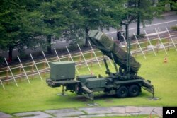 FILE - A PAC-3 Patriot missile unit is seen deployed in the compound of the Defense Ministry in Tokyo, Japan, Aug. 10, 2017.