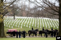 A funeral procession at Arlington National Cemetary.
