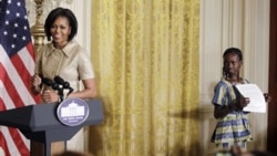 First lady Michelle Obama was introduced by Aissatou Hamidou Diallo, 13, from Burkino Faso, at the White House on Tuesday. The reception marked the 100th anniversary of International Women's Day.