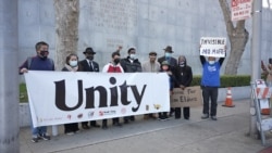 Community members take part in a protest to raise awareness of anti-Asian violence and racist attitudes, outside the Hall of Justice, San Francisco, March 4, 2021.