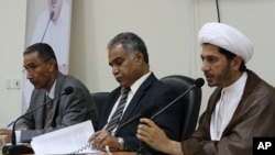 Opposition leaders (from left to right) Mahmood al-Rajab, Radhi Mohsen al-Mosawi and Sheikh Ali Salman speak at a joint press conference in Umm Al Hassam, Bahrain, February 15, 2012.