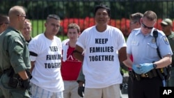 Demonstrators are arrested outside the White House in Washington, Aug. 28, 2014, during a protest for immigration reform. Trump's plans could lead to the deportation of more than six million illegal immigrants.