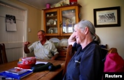 Farmer Dick Smith reacts as he sits with his wife, Sue, at their home, located near the outback town of Stonehenge, in Queensland, Australia, Aug. 12, 2017.