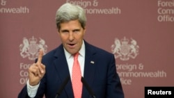 U.S. Secretary of State John Kerry gestures during his joint news conference with Britain's Foreign Secretary William Hague in London, Sept. 9, 2013. 