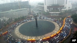 FILE - A traffic jam during heavy rain at the main roundabout in Jakarta, Indonesia.