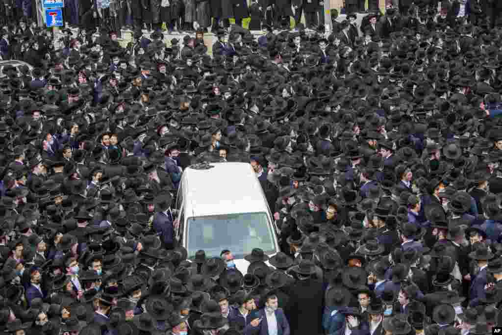 Thousands of ultra-Orthodox Jews participate in the funeral for prominent rabbi Meshulam Soloveitchik in Jerusalem.