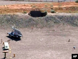 This image provided by the U.S. Department of Energy shows a 20-foot by 20-foot hole in the roof of a storage tunnel at the Hanford Nuclear Reservation near Richland, Washington, May 9, 2017.
