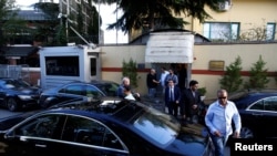 Officials leave Saudi Arabia's consulate in Istanbul, Turkey, Oct. 7, 2018.