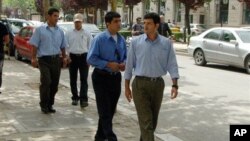 View of some members of the Iranian opposition resistance Mujahedeen-e- Khalq group, who have resettled in Albania from Iraq, in a street, in Tirana, Albania, Friday, May 17, 2013. The first exiles from an Iranian opposition group have moved to Albania 