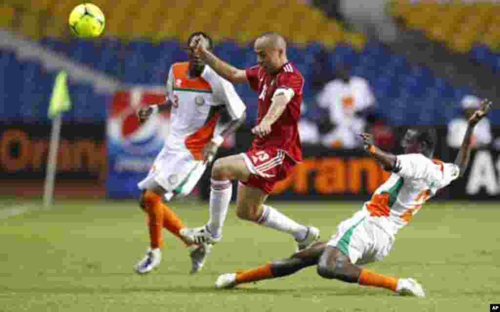 Niger's Ouwo Moussa Maazou (2) tackles by Morocco's Houssine Kharja (13) during their final African Cup of Nations Group C soccer match at the Stade De L'Amitie Stadium in Libreville, Gabon January 31, 2012.
